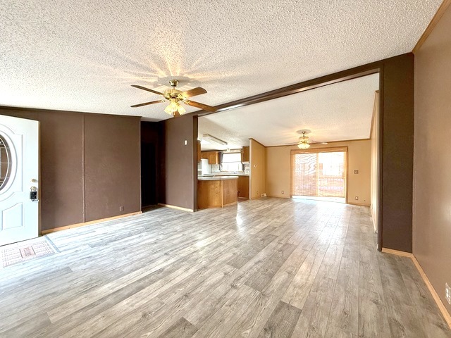 9 Swallow Lane Beecher, IL 60401 - Photo 7 of 20 a view of an empty room with window and wooden floor