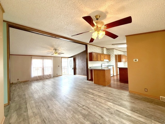 9 Swallow Lane Beecher, IL 60401 - Photo 9 of 20 a view of an empty room with a window and kitchen view