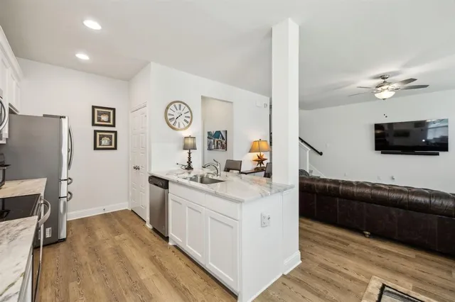 a view of living room with furniture and flat screen tv