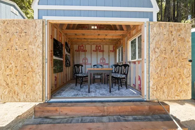 a dining room with table and chairs