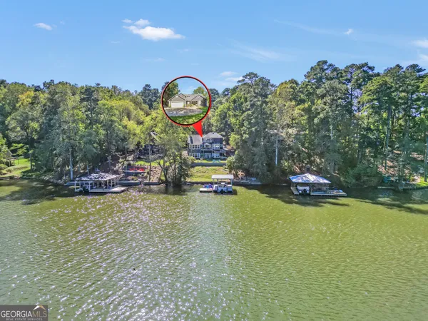 swimming pool view with a seating space and a garden view