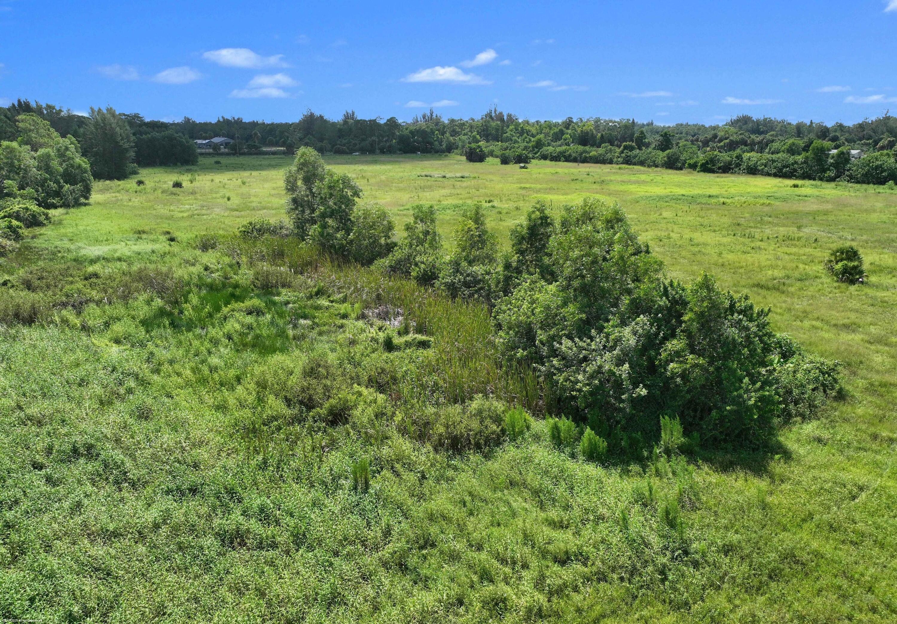 2761 E Road Loxahatchee Groves, FL 33470 - Photo 11 of 21 a view of outdoor space with yard and green space