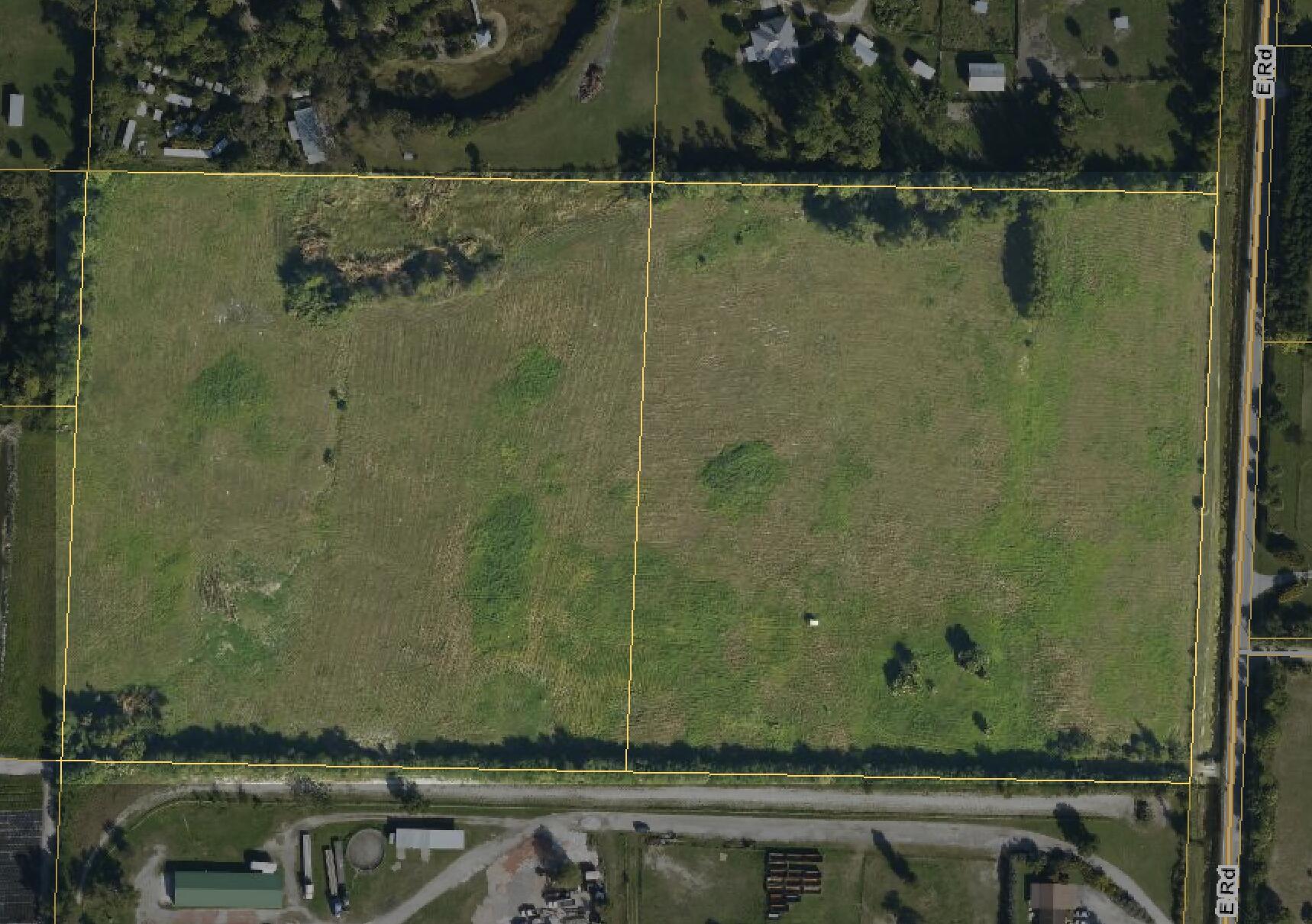 2761 E Road Loxahatchee Groves, FL 33470 - Photo 6 of 21 an aerial view of a residential houses with outdoor space