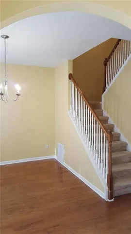 a view of a hallway with staircase
