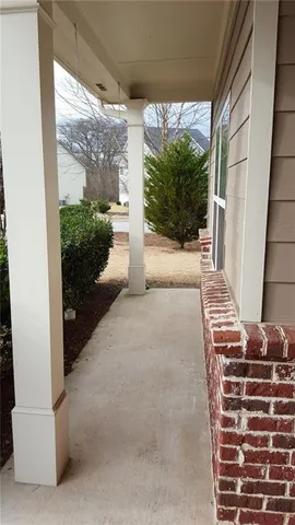 a view of potted plants in front of a building