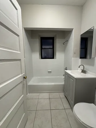 a bathroom with a sink a toilet and bathtub