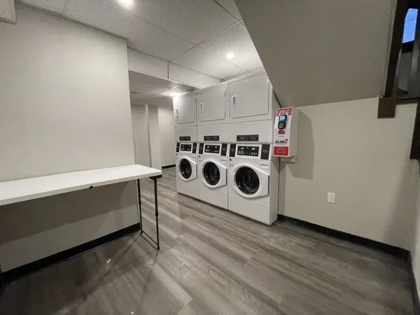 a utility room with dryer and washer