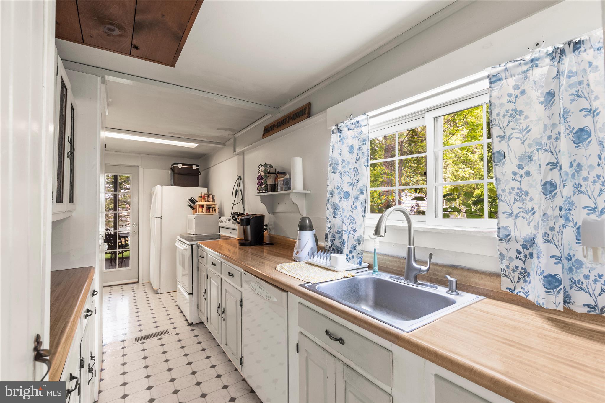 2963 Spring Valley Road Lancaster, PA 17601 - Photo 11 of 42 a large white kitchen with a sink and large window