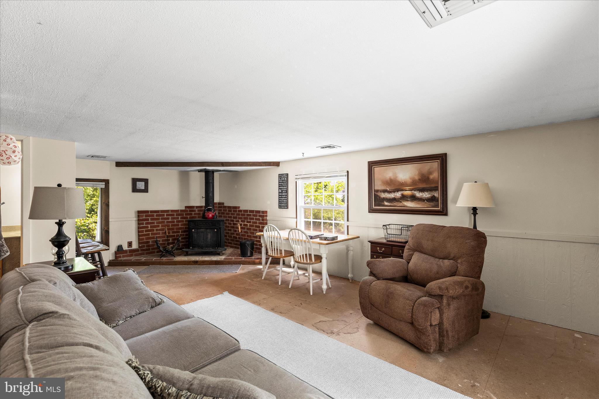 2963 Spring Valley Road Lancaster, PA 17601 - Photo 19 of 42 a living room with furniture a flat screen tv and a fireplace