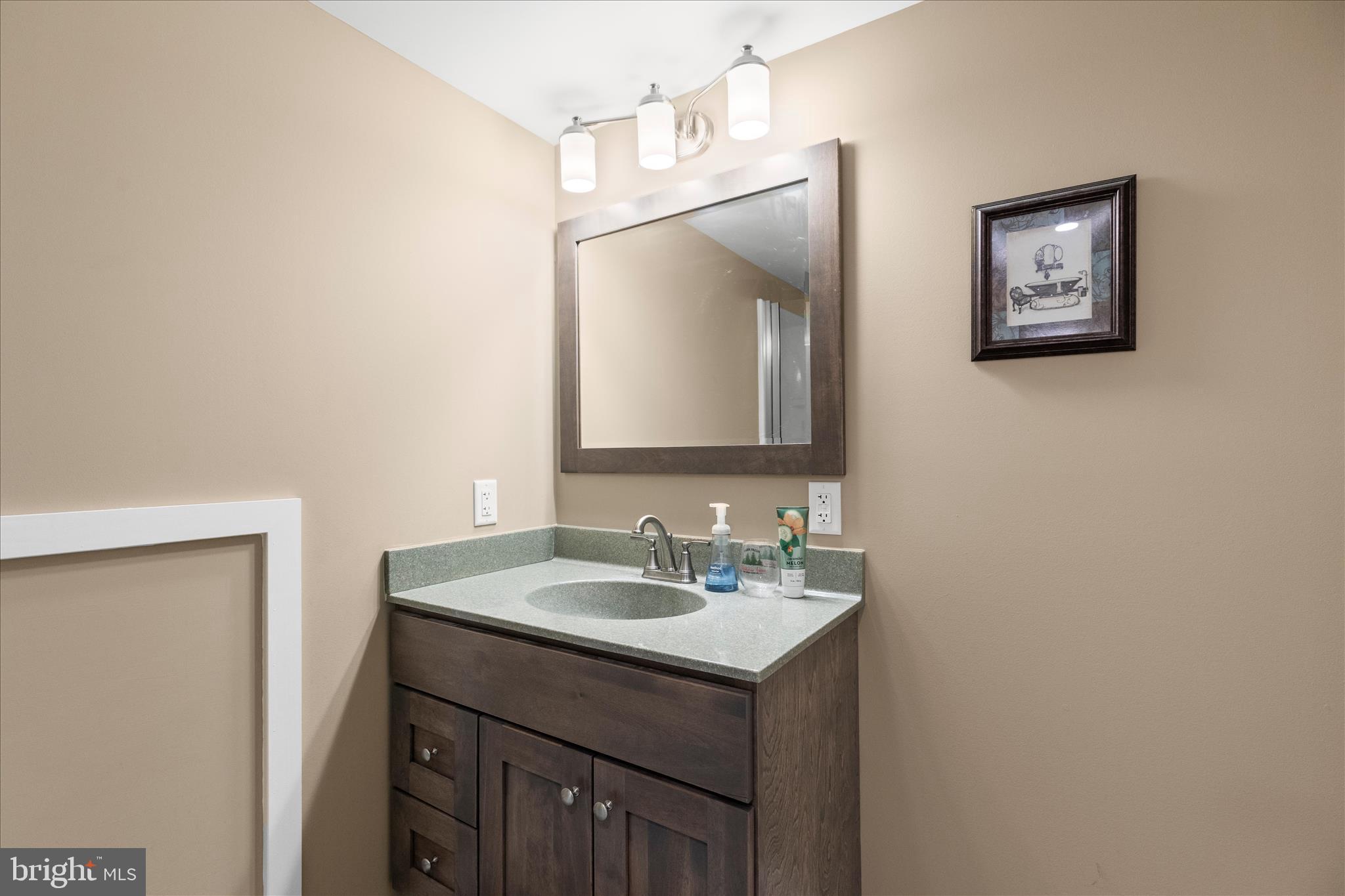 2963 Spring Valley Road Lancaster, PA 17601 - Photo 23 of 42 a bathroom with a sink and a mirror