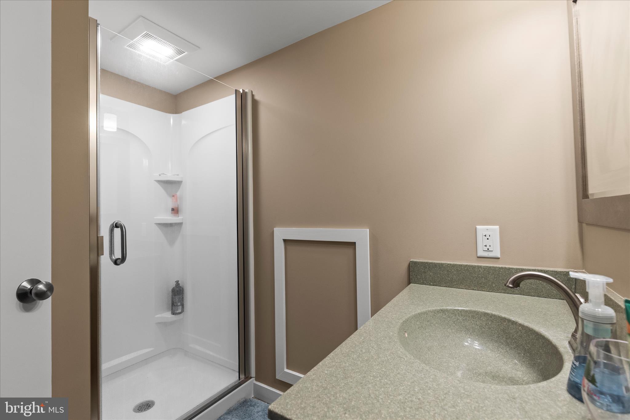 2963 Spring Valley Road Lancaster, PA 17601 - Photo 24 of 42 a bathroom with a sink and a mirror