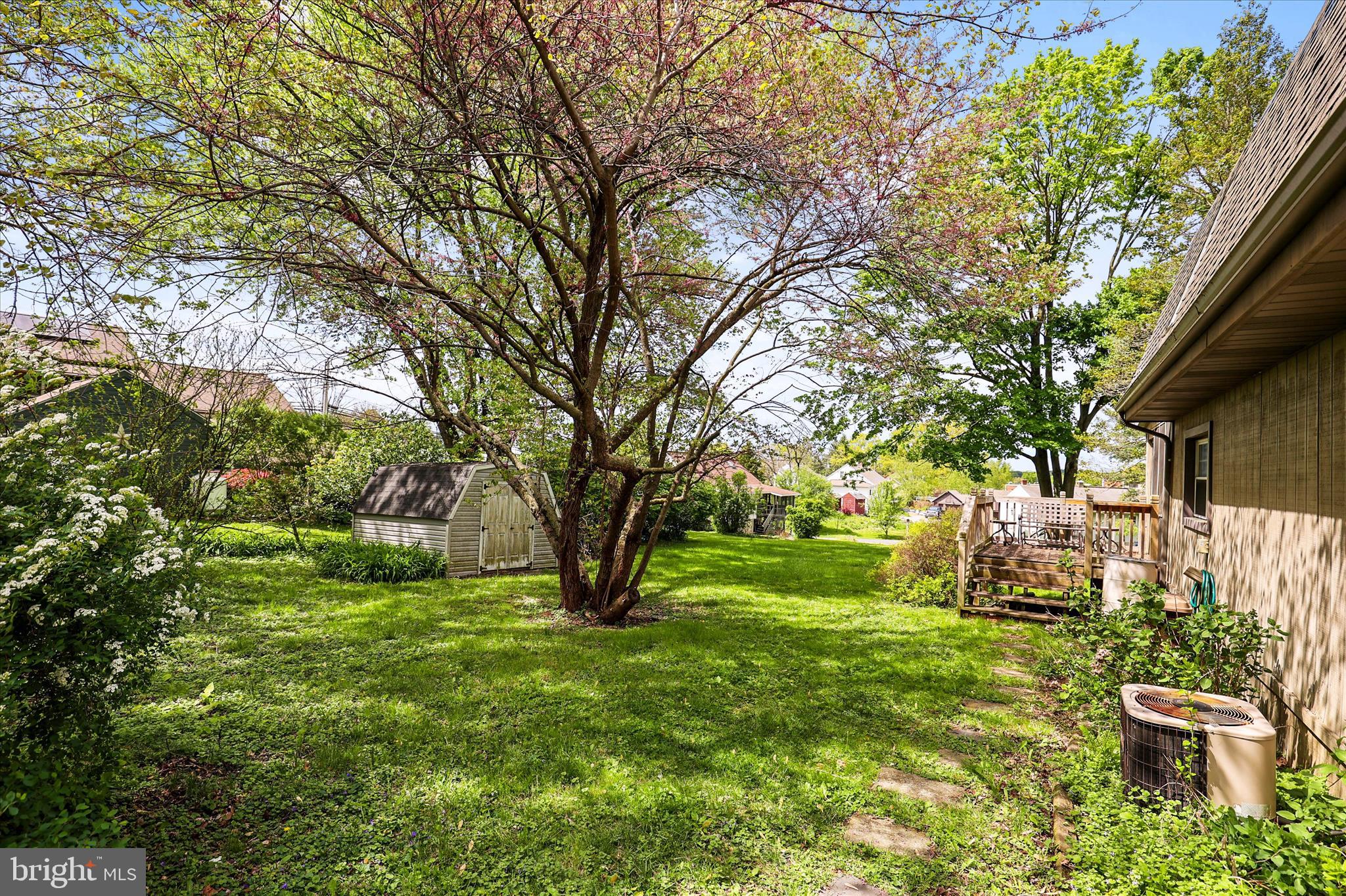 2963 Spring Valley Road Lancaster, PA 17601 - Photo 32 of 42 a view of a backyard with table and chairs and a large tree