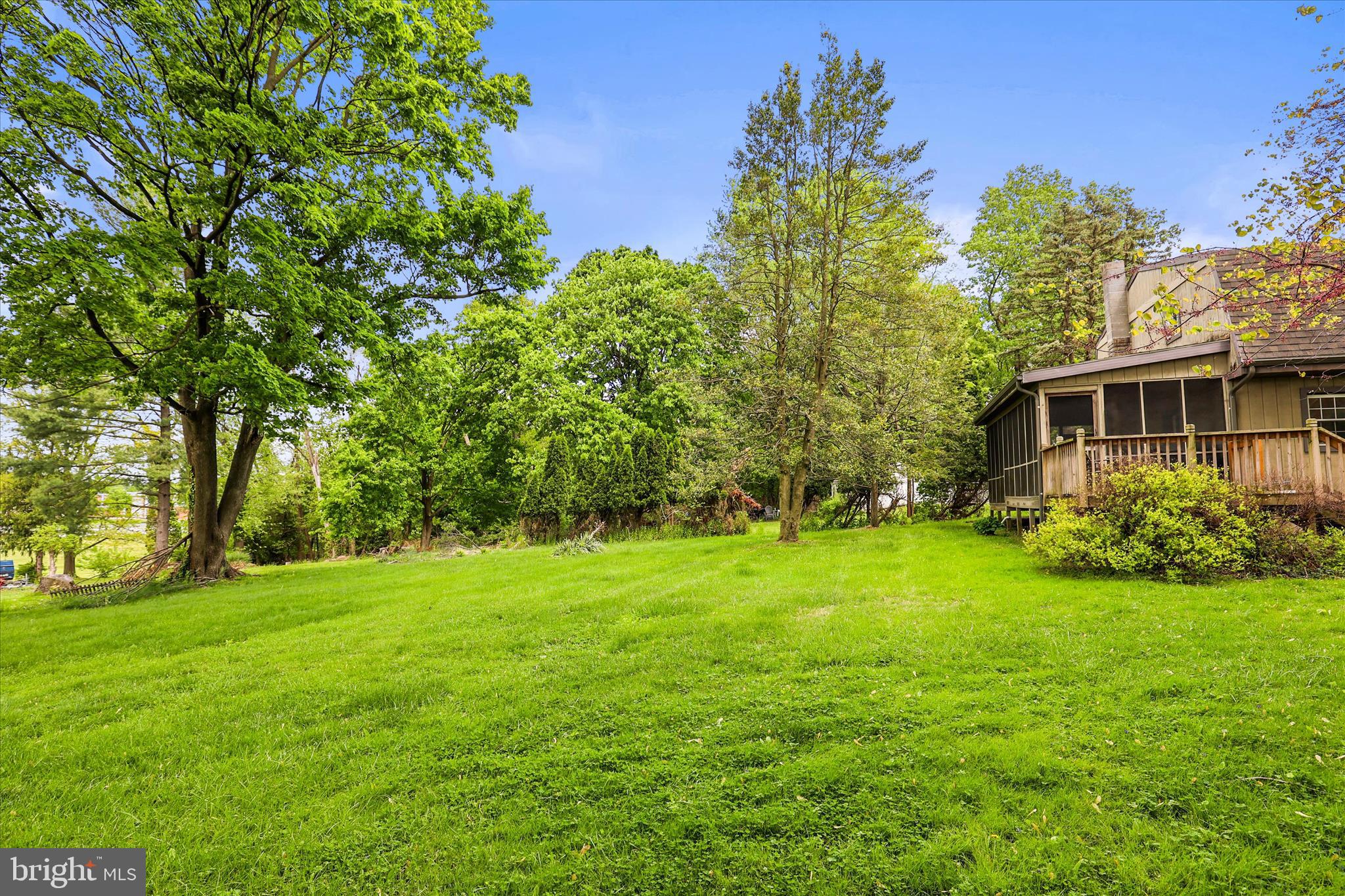 2963 Spring Valley Road Lancaster, PA 17601 - Photo 36 of 42 a backyard of a house with plants and large trees