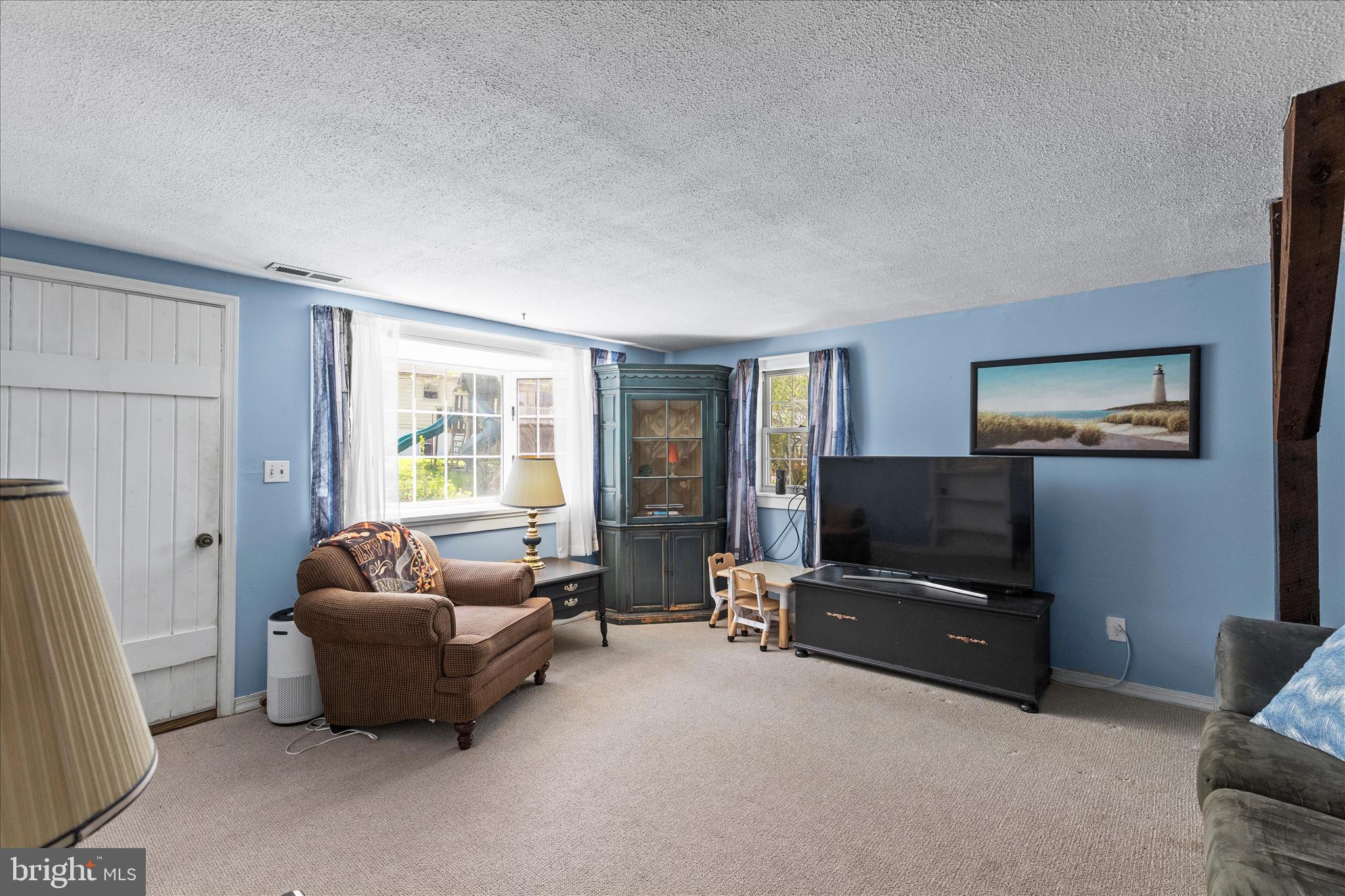 2963 Spring Valley Road Lancaster, PA 17601 - Photo 6 of 42 a living room with furniture and a flat screen tv