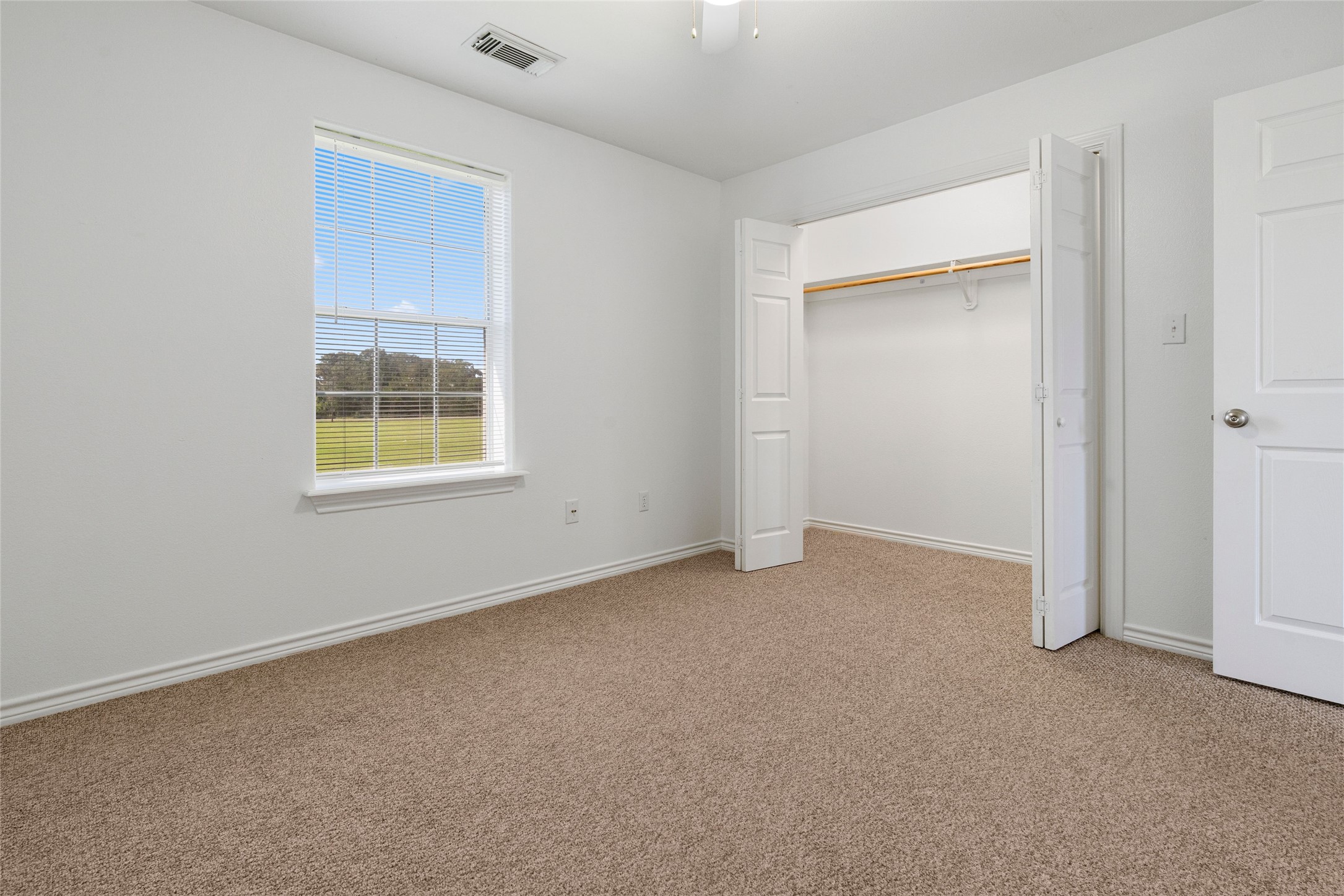 210 Brazos Street, Unit 202 Brazoria, TX 77422 - Photo 13 of 20 an empty room with windows and closet