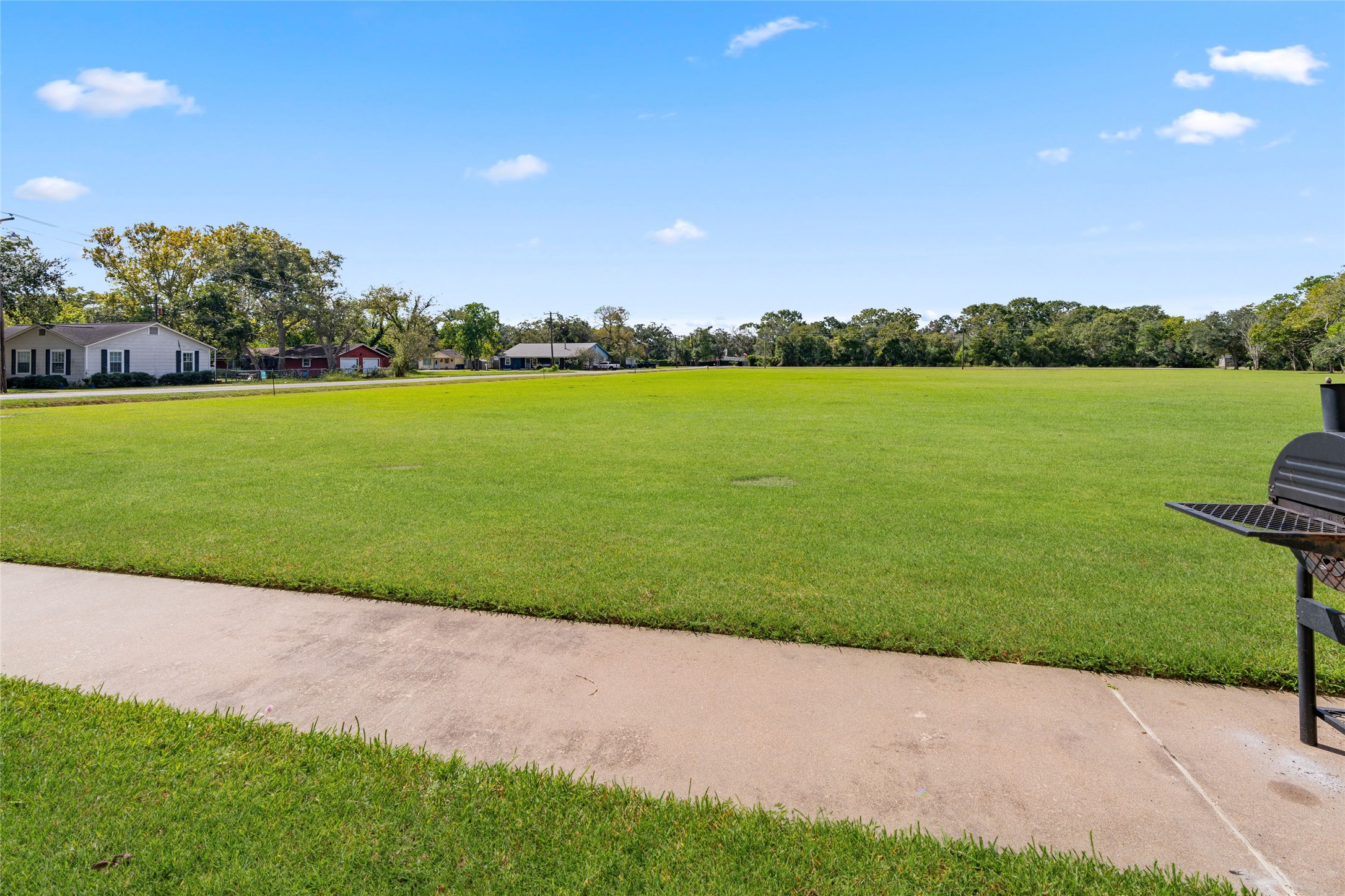 210 Brazos Street, Unit 202 Brazoria, TX 77422 - Photo 17 of 20 a view of a garden and lake