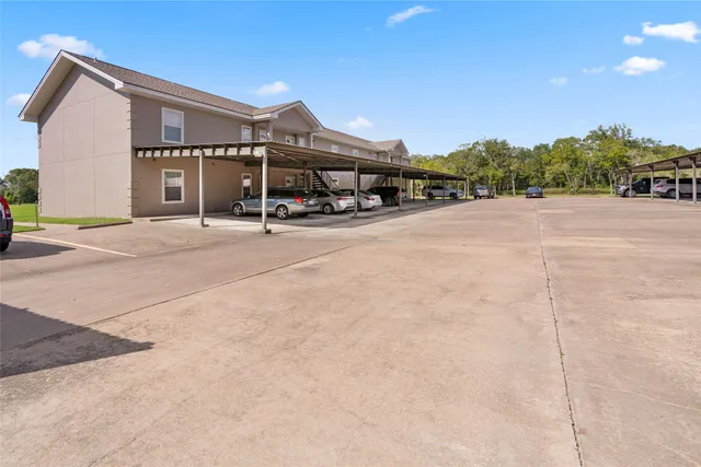 a roof deck with yard and outdoor seating