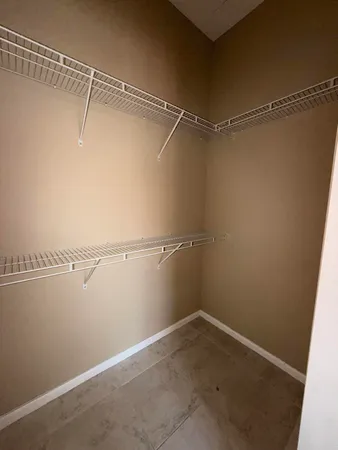 a view of a room with racks on the wall
