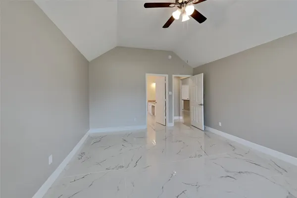 an empty room with a ceiling fan and window