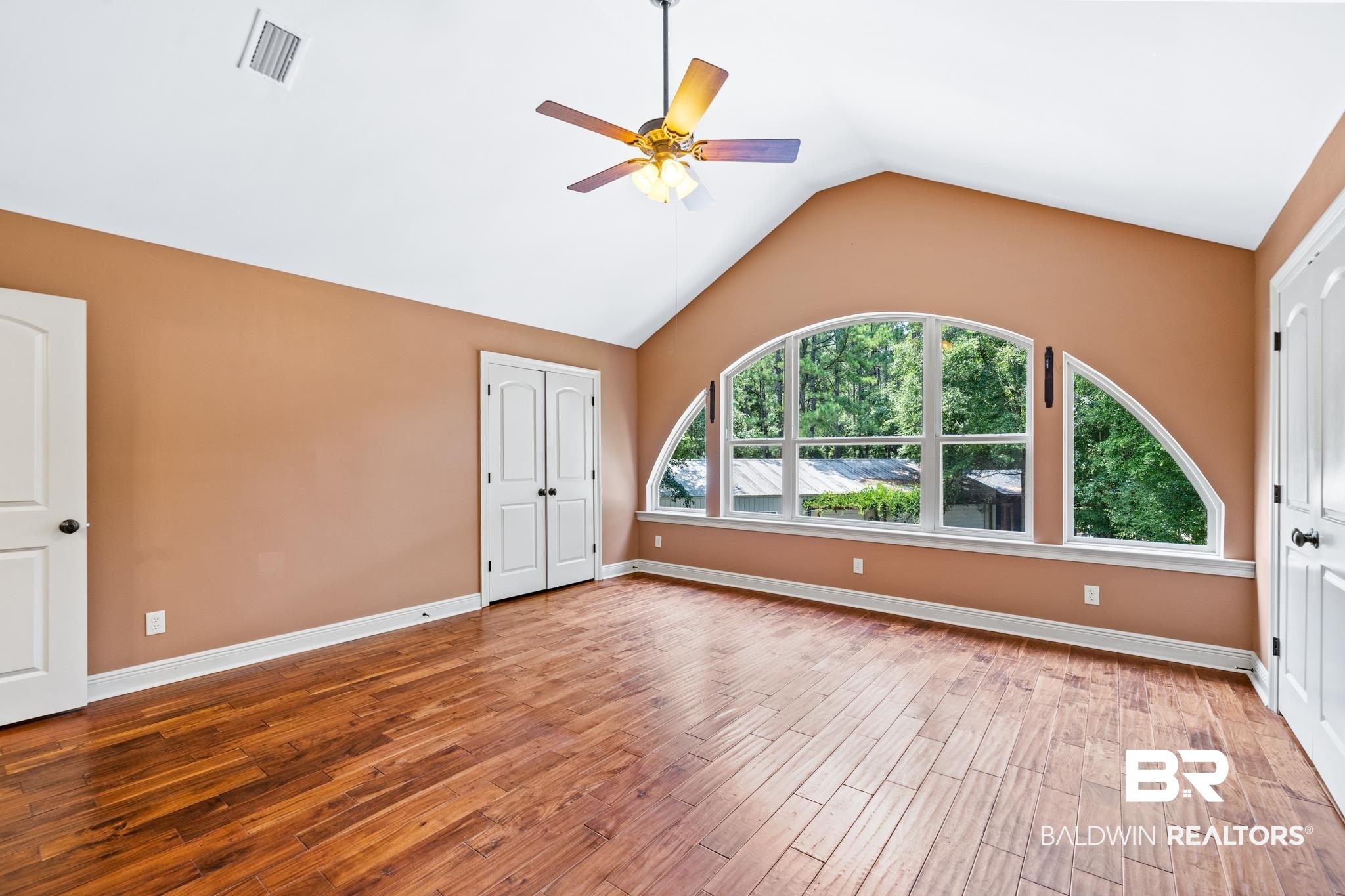 8321 Dixon Road Bay Minette, AL 36507 - Photo 48 of 79 Spare room with ceiling fan, wood-type flooring, and vaulted ceiling