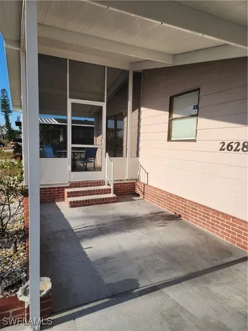 a view of a house with a door and a window