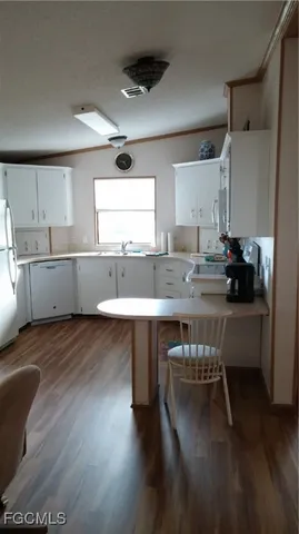 a kitchen with counter and chair in it