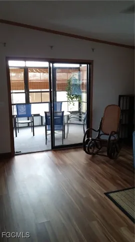 a view of workspace with wooden floor and windows