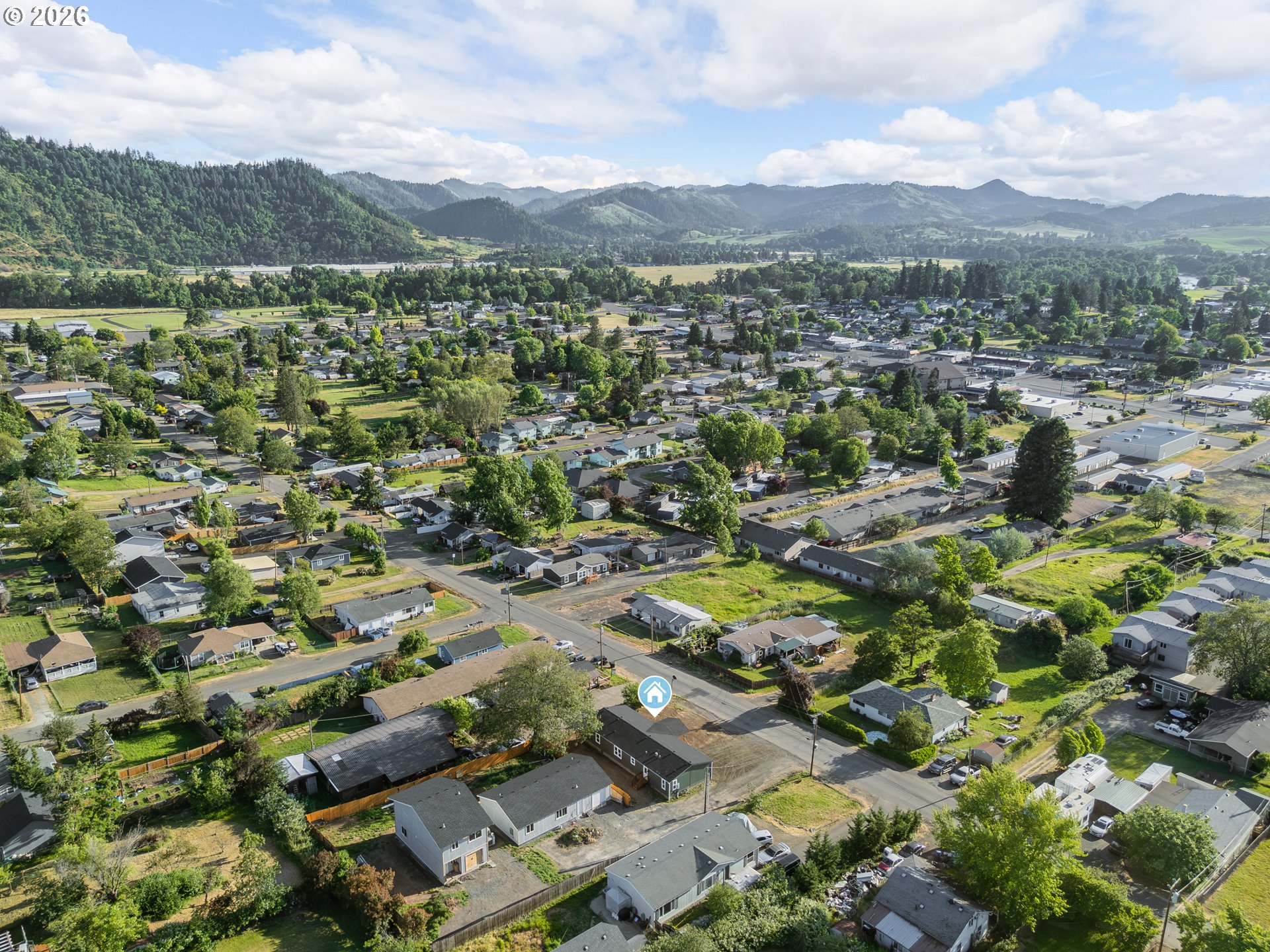 70 Darrell Avenue Winston, OR 97496 - Photo 37 of 39 an aerial view of residential houses with outdoor space and trees