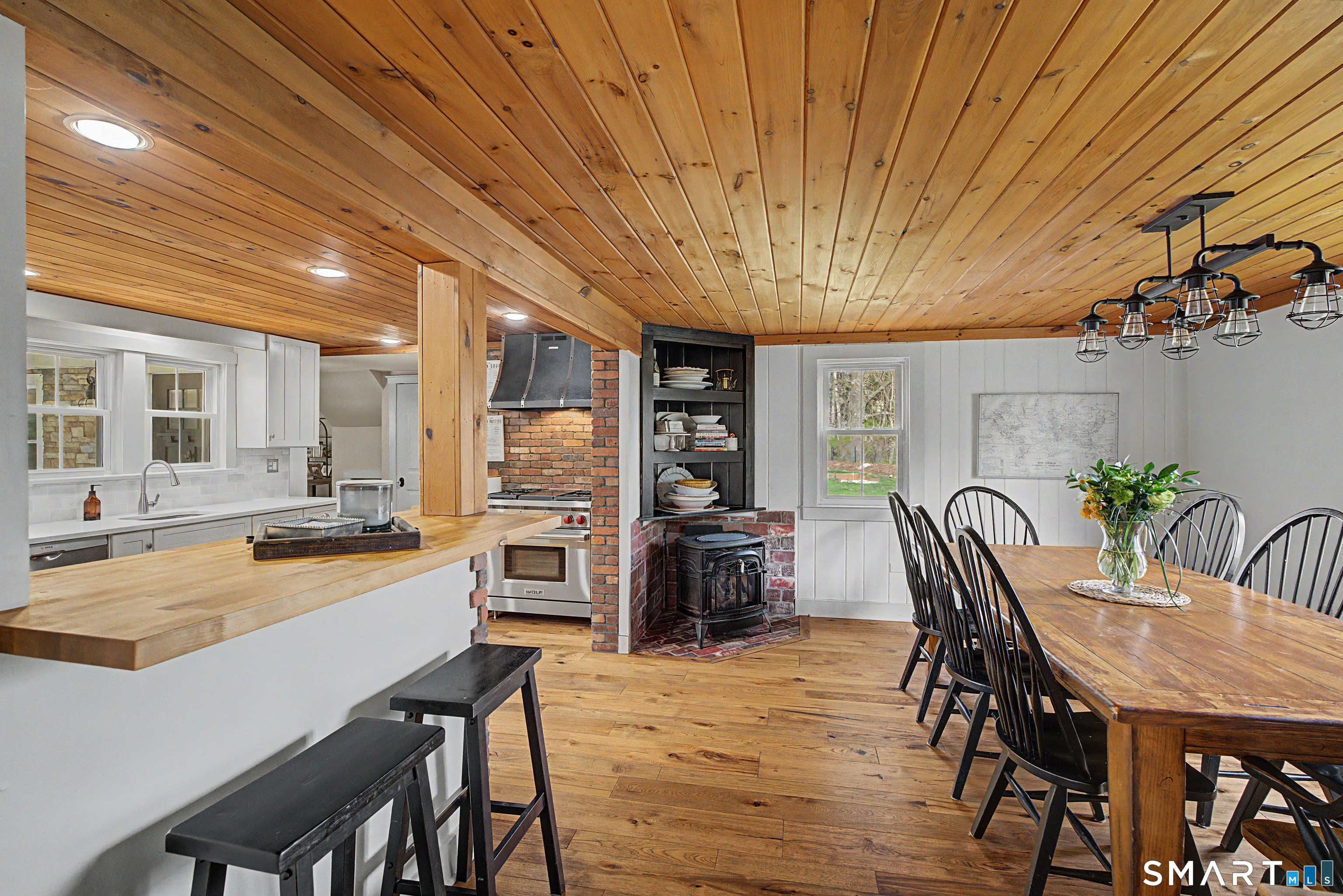 602 Durham Road Madison, CT 06443 - Photo 11 of 34 Attached dining room with gas log fireplace