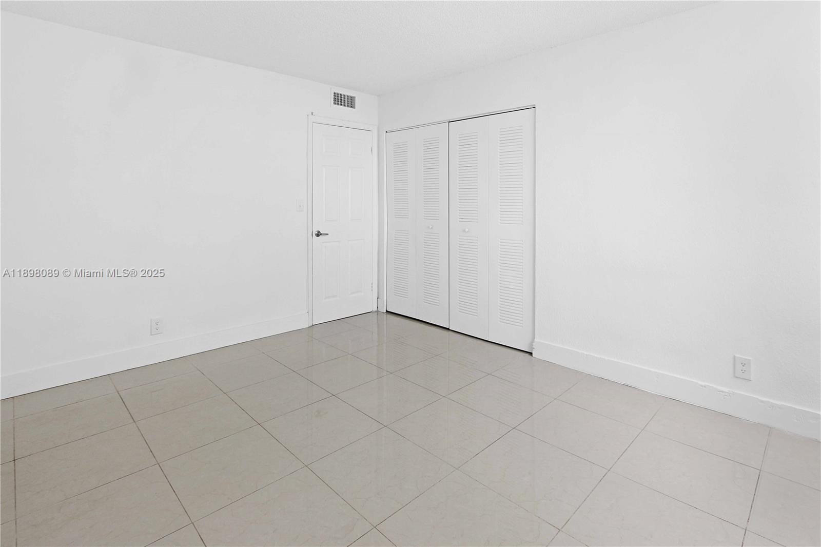 9001 Southwest 77th Avenue, Unit C803 Miami, FL 33156 - Photo 10 of 20 a view of an empty room