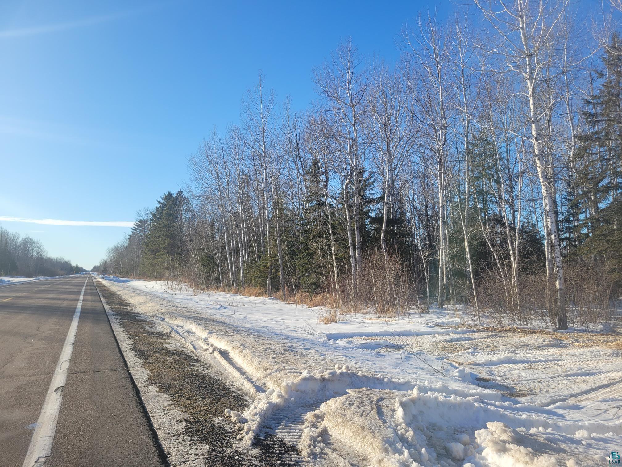 13 Port Wing Wi 54865 Port Wing, WI 54865 - Photo 2 of 21 View of asphalt road featuring a wooded view