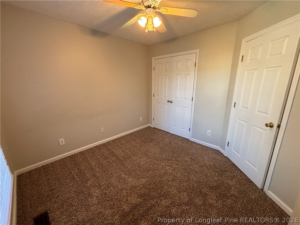 543 Killeen Road Fayetteville, NC 28303 - Photo 24 of 29 a view of an empty room and chandelier fan