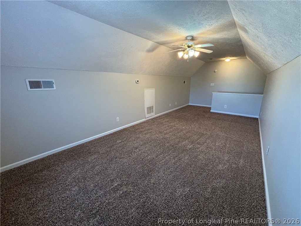 543 Killeen Road Fayetteville, NC 28303 - Photo 28 of 29 a view of an empty room with a chandelier fan