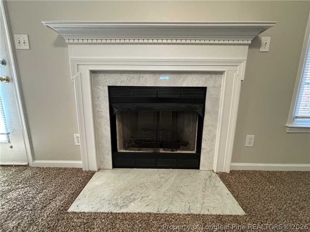 543 Killeen Road Fayetteville, NC 28303 - Photo 8 of 29 a view of empty room with a fireplace