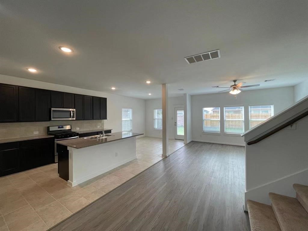 815 Summer Village Way Rosenberg, TX 77469 - Photo 4 of 21 a view of kitchen with sink microwave and stove