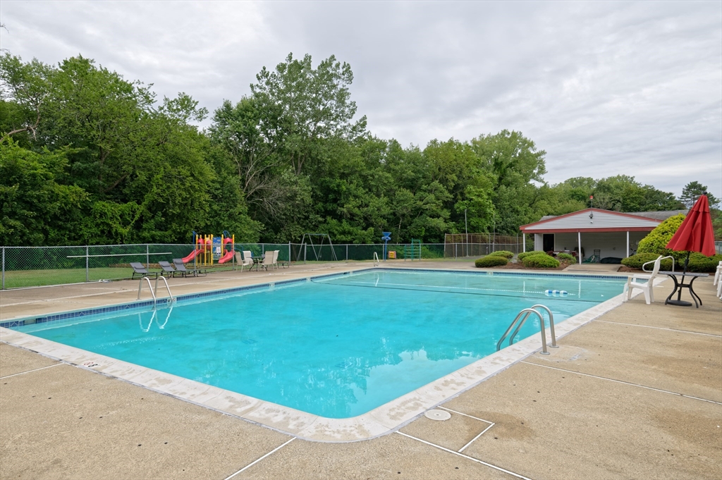 2 Universal Street, Unit 4 Framingham, MA 01702 - Photo 14 of 18 a view of a swimming pool with a yard