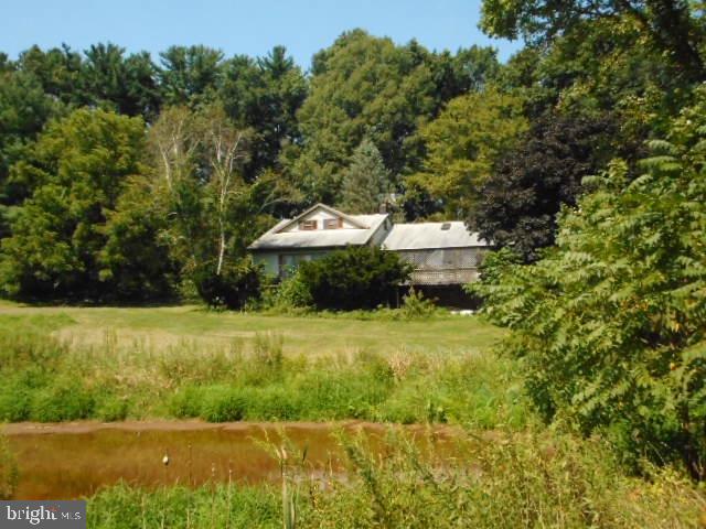5668 Pine Road Thomasville, PA 17364 - Photo 2 of 32 Front View w/ Pond