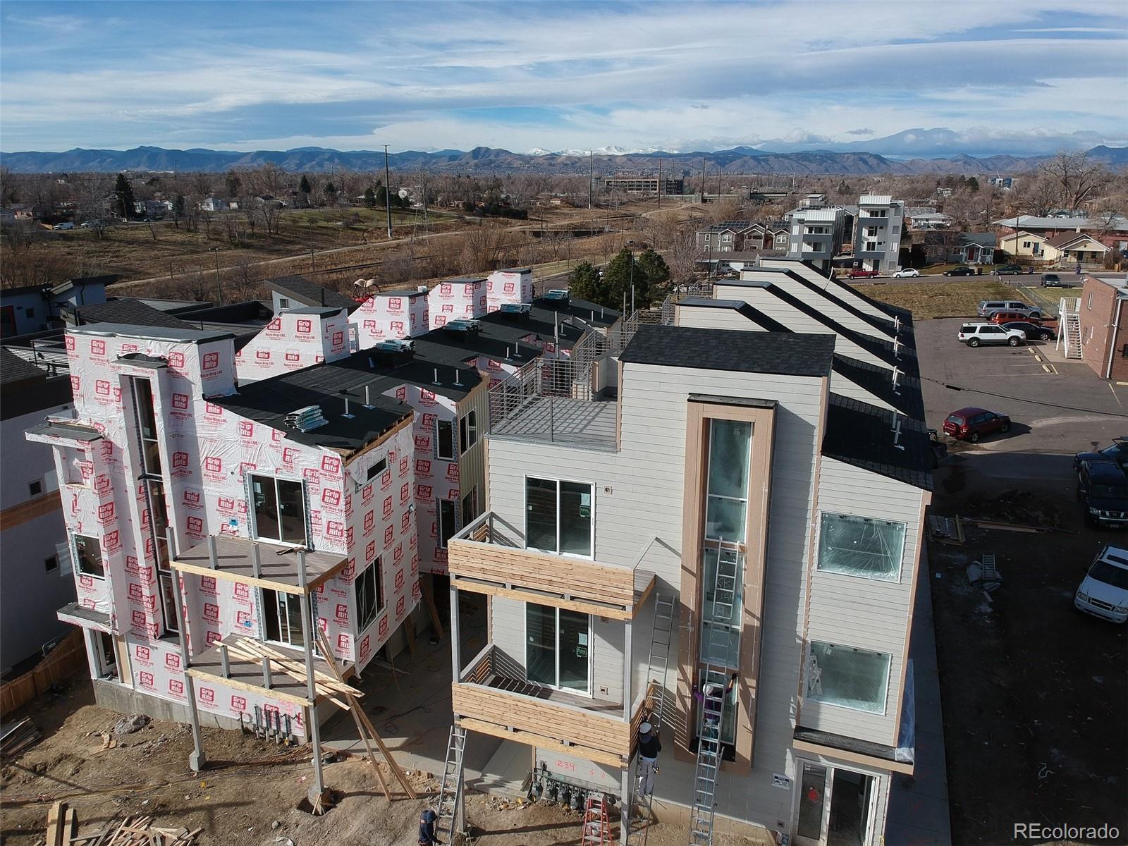 1239 Tennyson Street, Unit 6 Denver, CO 80204 - Photo 1 of 16 a view of a city with tall buildings