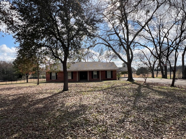5173 Burt Road Bryan, TX 77807 - Photo 1 of 1 a big tree in middle of the garden