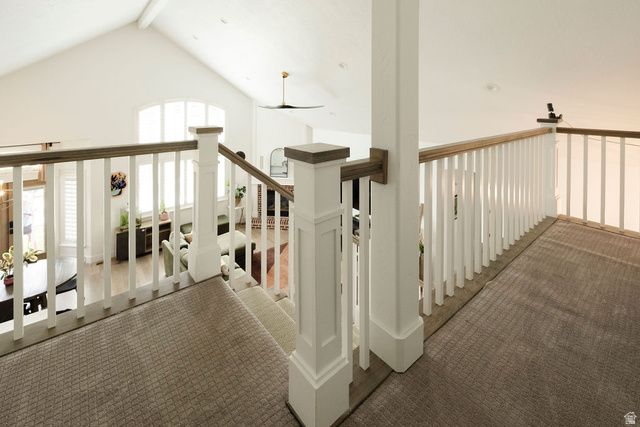 924 Country Lane Farmington, UT 84025 - Photo 42 of 91 Carpeted upper-level landing with white balustrade and wood-finish handrail overlooking a vaulted great room