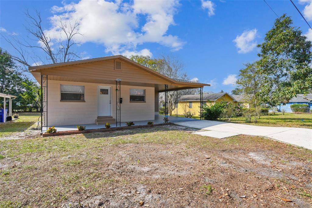 1422 Connestee Road Lakeland, FL 33805 - Photo 1 of 1 a view of an house with backyard and trees