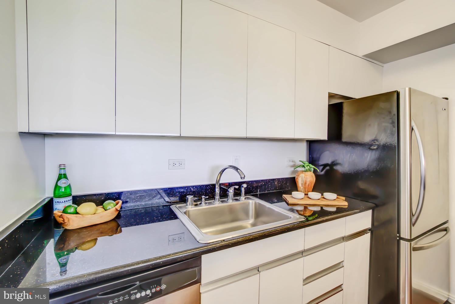 2501 M Street Northwest, Unit 722 Washington, DC 20037 - Photo 14 of 39 Kitchen with stainless steel appliances