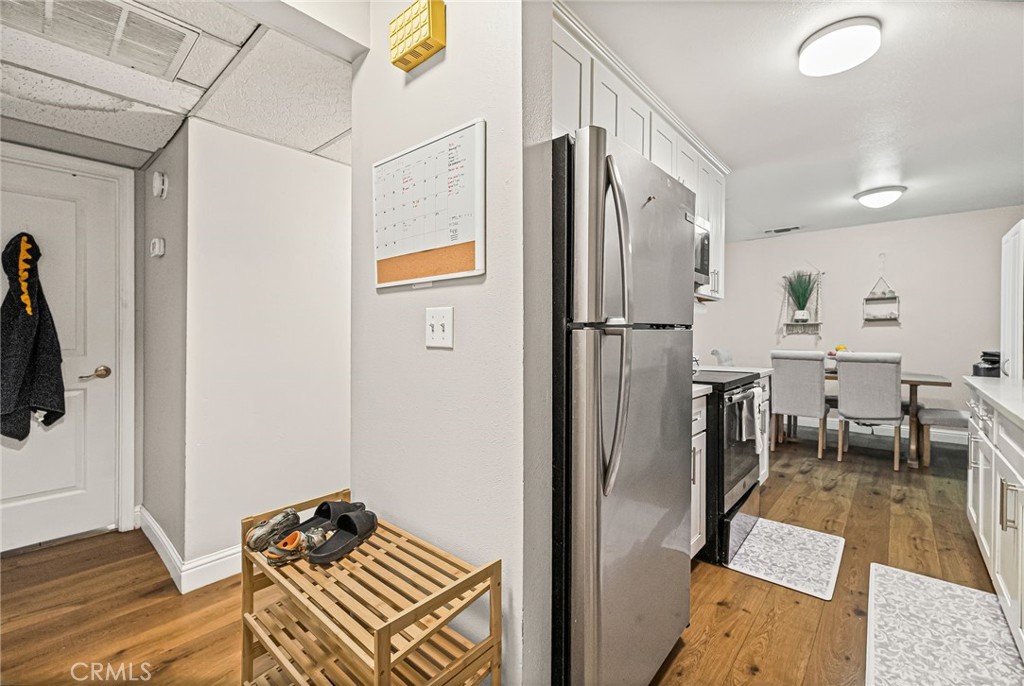 1395 Nord Avenue Chico, CA 95926 - Photo 13 of 26 a kitchen with stainless steel appliances refrigerator stove dining table and chairs