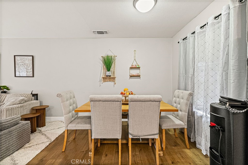 1395 Nord Avenue Chico, CA 95926 - Photo 17 of 26 a view of a dining room with furniture and wooden floor