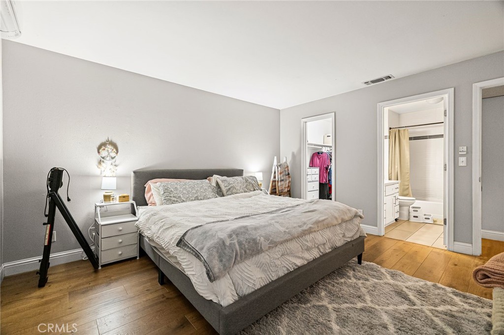 1395 Nord Avenue Chico, CA 95926 - Photo 19 of 26 a bedroom with a bed and a dresser in it