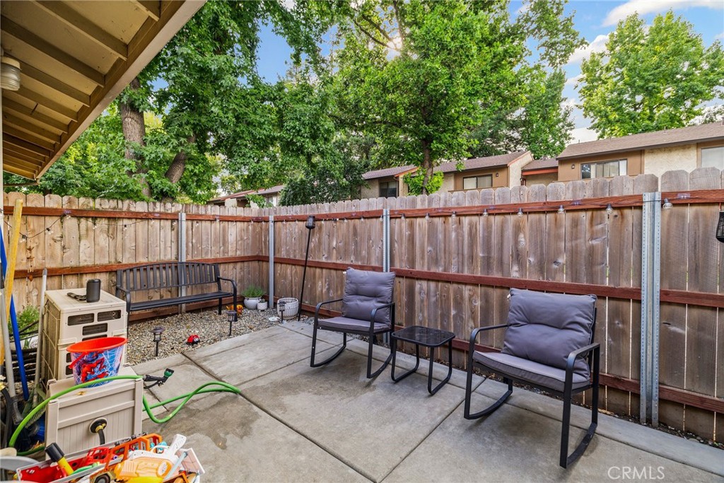 1395 Nord Avenue Chico, CA 95926 - Photo 26 of 26 a backyard of a house with barbeque oven and outdoor seating
