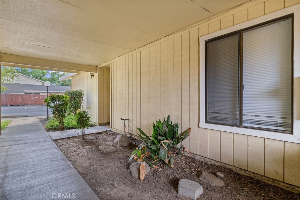 1395 Nord Avenue Chico, CA 95926 - Photo 3 of 26 a backyard of a house with plants and outdoor seating