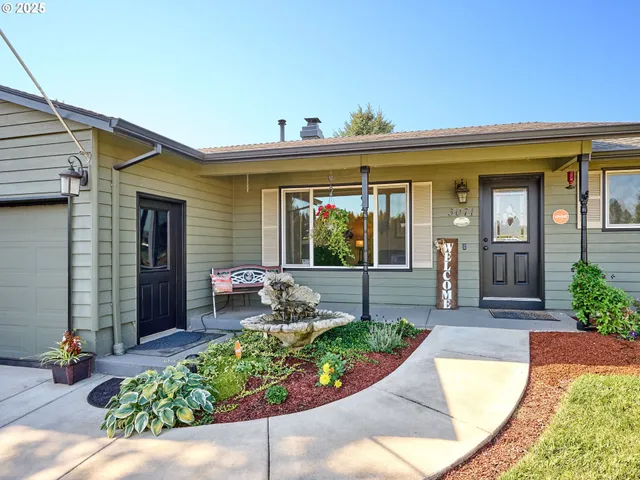 a front view of a house with garden