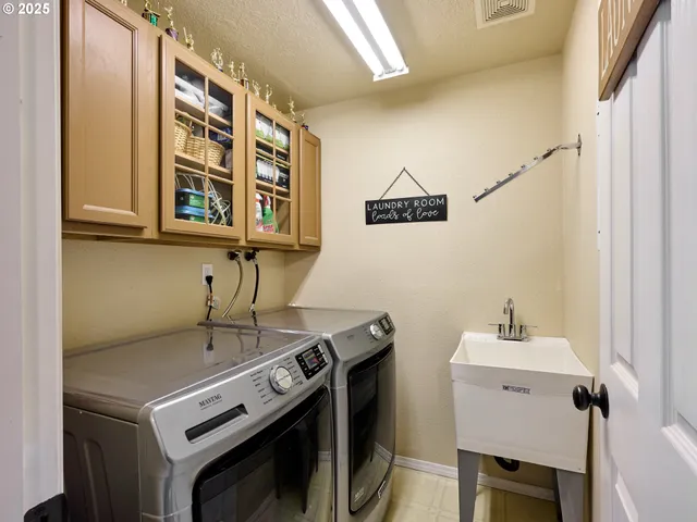 a utility room with dryer and washer