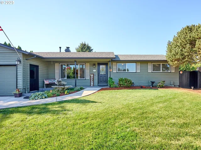 a view of house with backyard outdoor seating and hardwood